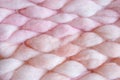 Texture of pink big knit blanket. Large knitting. Plaid merino wool. Top view Royalty Free Stock Photo