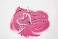 The texture of pink lipstick drawn heart pierced by an arrow, love, cheating, make-up Royalty Free Stock Photo