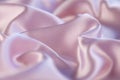 Texture of pink satin or silk in the form of waves, front view, photo backgrounds.