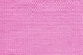 Texture of pink wool knitted fabric close up, abstract textile background Royalty Free Stock Photo
