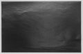 Texture of plain black paper on white background Royalty Free Stock Photo