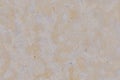 Texture of porous limestone stone of orange color. Wall background with specks and dots. The texture of the Sandstone surface Royalty Free Stock Photo