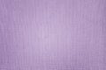 Texture of purple paper with irregularities and embossed close-up. Background for layouts.