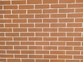 Texture red brick wall. Background from new brown bricks with white cement. Royalty Free Stock Photo