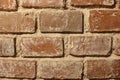 Texture of a red brick wall with sand Royalty Free Stock Photo