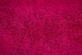 The texture of a red cloth with a pile, a bath towel for a shower. Royalty Free Stock Photo
