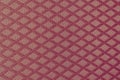 Texture of red fabric with rombic pattern