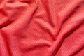 Texture of red fabric with subtle geometric patterns and soft drapery folds Royalty Free Stock Photo