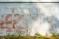 Texture of red fluted brick wall with white peeling paint