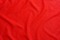 Texture of red luxury expensive fabric. Mockup of designer for making flag on wavy colorful background Royalty Free Stock Photo