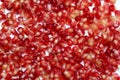 Texture of red pomegranate seeds laid out on the surface