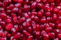 Texture of red ripe pomegranate seeds closeup