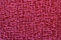 Texture of red velor fabric close up