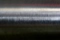 Texture of reflection on stainless steel pipe in dark room, abstract background Royalty Free Stock Photo