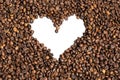 Texture of roasted coffee beans with transparent background. a heart shape in the center of the image Royalty Free Stock Photo