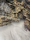 Texture of rock and sand on a beach with traces of water, shore background, detail of a rocky beach Royalty Free Stock Photo