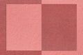 Texture of rose and maroon paper background with geometric shape and pattern, macro. Structure of craft pink cardboard