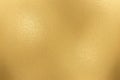 Texture of rough gold metallic sheet, abstract background