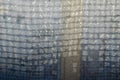 Texture of a rough white fabric. Repeating patterns woven from t