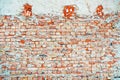 Texture of rough worn brick wall. Old facade as background. Urban patterns and details Royalty Free Stock Photo