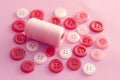 Texture with round pink buttons for sewing, needlework, and thread