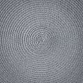 The texture of a round wicker mat as a background