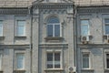 Texture of a row of windows on a gray wall of an old house Royalty Free Stock Photo