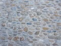 Texture of rural wall or floor. Oval natural raw stone, cement as fixative