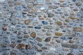 Texture of rural wall or floor. Oval natural raw stone, cement as fixative. Sallent de Gallego, Aragon, Spain