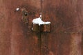 The texture of a rusty metal door with a corner for a padlock Royalty Free Stock Photo