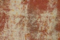 The texture is a rusty metallic orange painted surface with paint cracks and rust spots. background Royalty Free Stock Photo