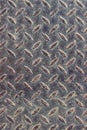 Texture of a rusty steel checkered plate with small rice projections