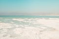 texture of salt deposits bank on the Dead Sea, Israel, beautiful landscape on a clear day with clear blue sky, jordan mountains