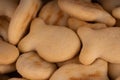 Texture of salted crackers. Close up of cookies in form of fish. Concept of background for your text.