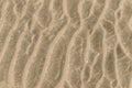 The texture of the sand on the beach in Trouville, France. Abstract background.