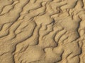 Texture of sand waves on the beach or in the desert. the ripples of the sand is diagonal. Royalty Free Stock Photo