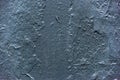Texture of a scratched painted dark blue wall