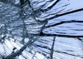 Texture of shiny blue mirror surface with small and large cracks