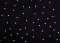 Texture of silk fabric. background. white polka dots on a black background. Delicate black and white silky fabric, polka dot backg Royalty Free Stock Photo