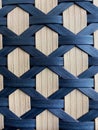 Texture of slatted panel with details of blue rhombuses