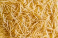 Texture of small pasta. Raw pasta close-up. Royalty Free Stock Photo
