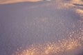 The texture of the snow on a frosty evening at sunset as a background Royalty Free Stock Photo