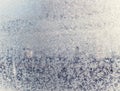 Texture of snow-white snowflakes on transparent glass. Beautiful frosty pattern on the window. Royalty Free Stock Photo