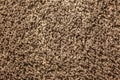 The texture is soft shaggy carpet brown