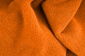 The texture of a soft warm orange fabric. Closeup Royalty Free Stock Photo