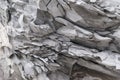 Texture of splinters cracked stones streaked and old crumbling concrete close-up gray color structure Royalty Free Stock Photo