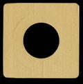 Texture - a square segment of brown corrugated cardboard with a round hole in the center Royalty Free Stock Photo