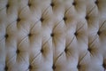 Texture of stained antique tufted couch