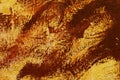 Texture of stains of brown paint on an orange wall Royalty Free Stock Photo