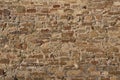 Texture of a stone brown wall of an ancient fortress Royalty Free Stock Photo